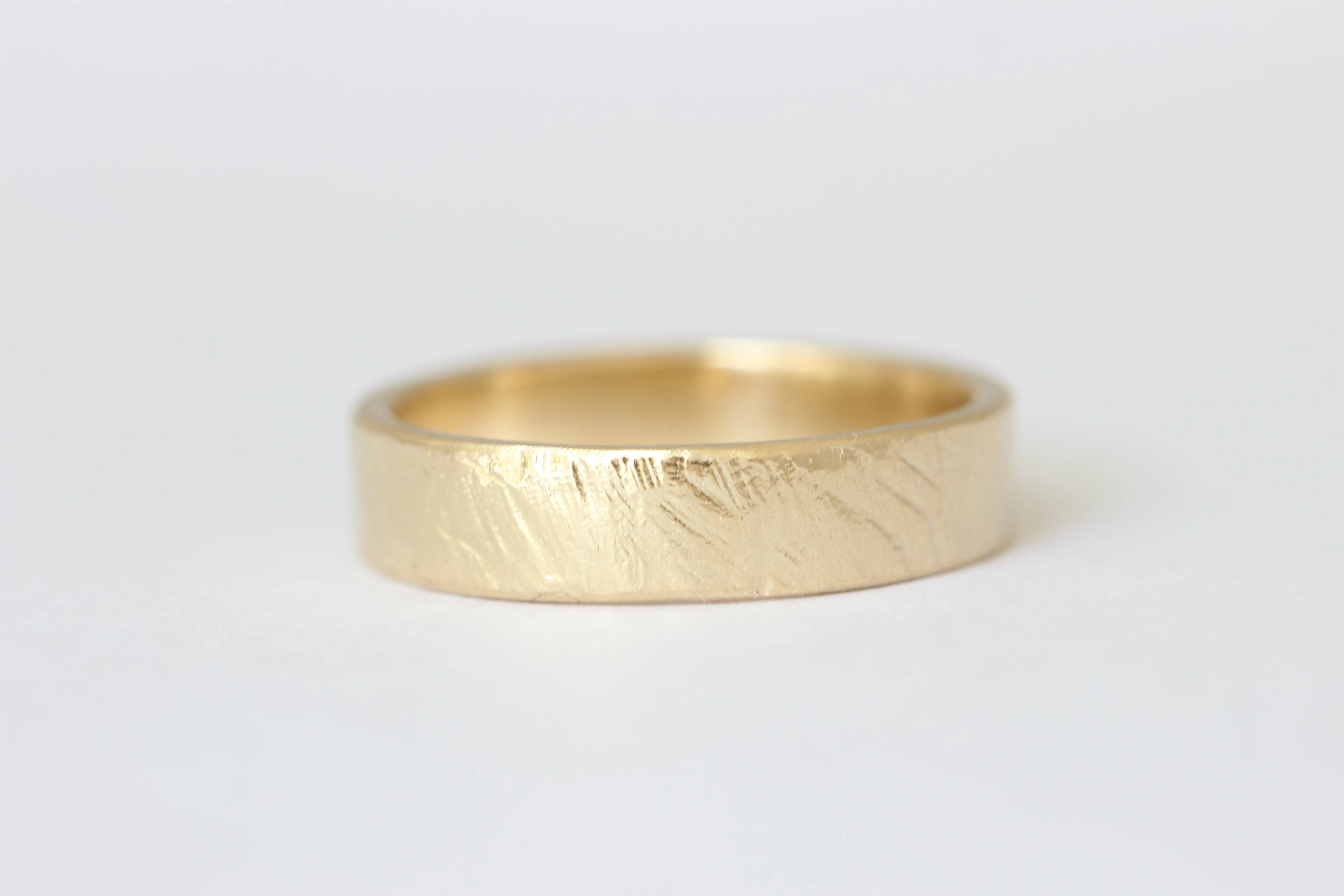 14k yellow gold wedding ring or stacker with shallow line texture