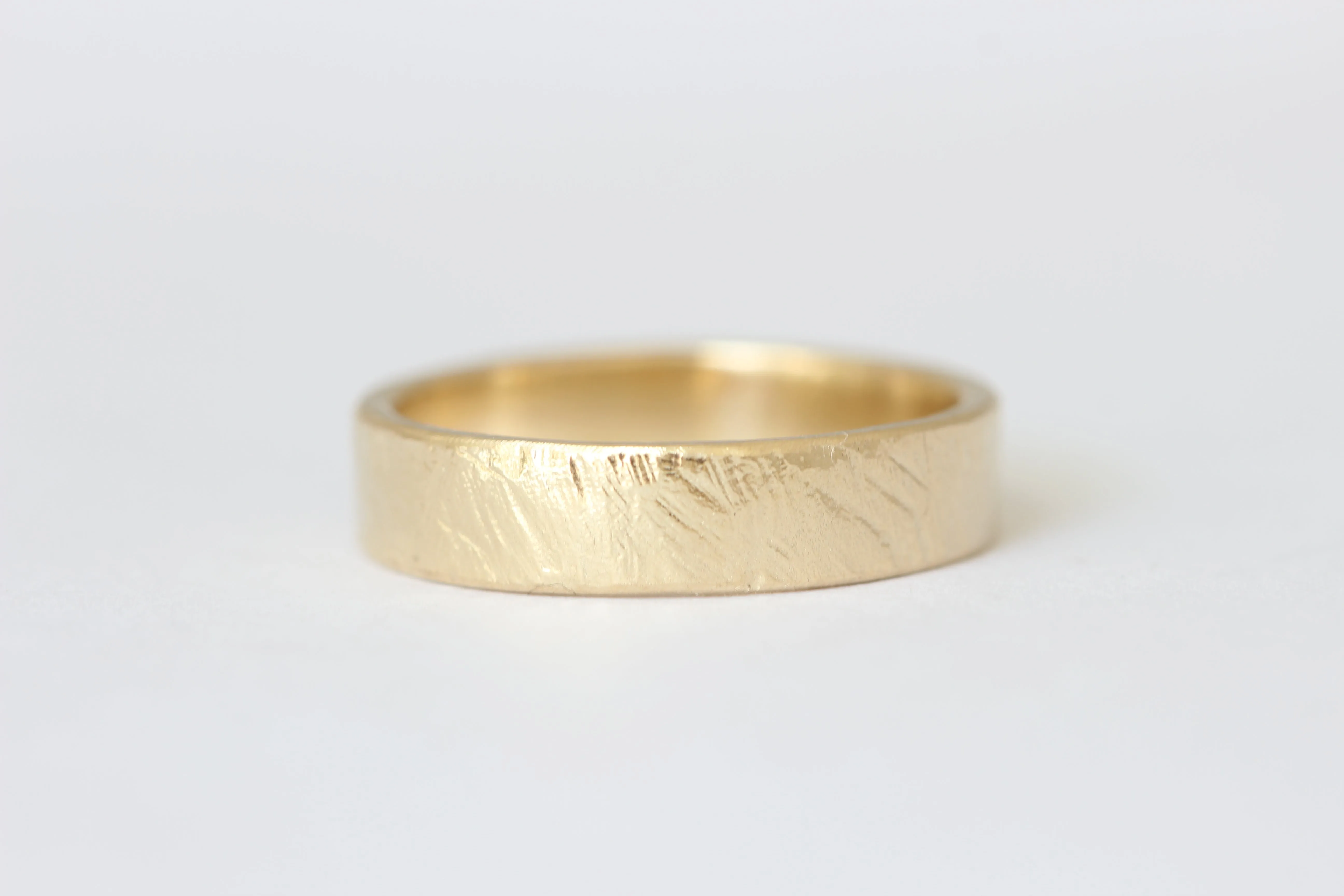 14k yellow gold wedding ring or stacker with shallow line texture